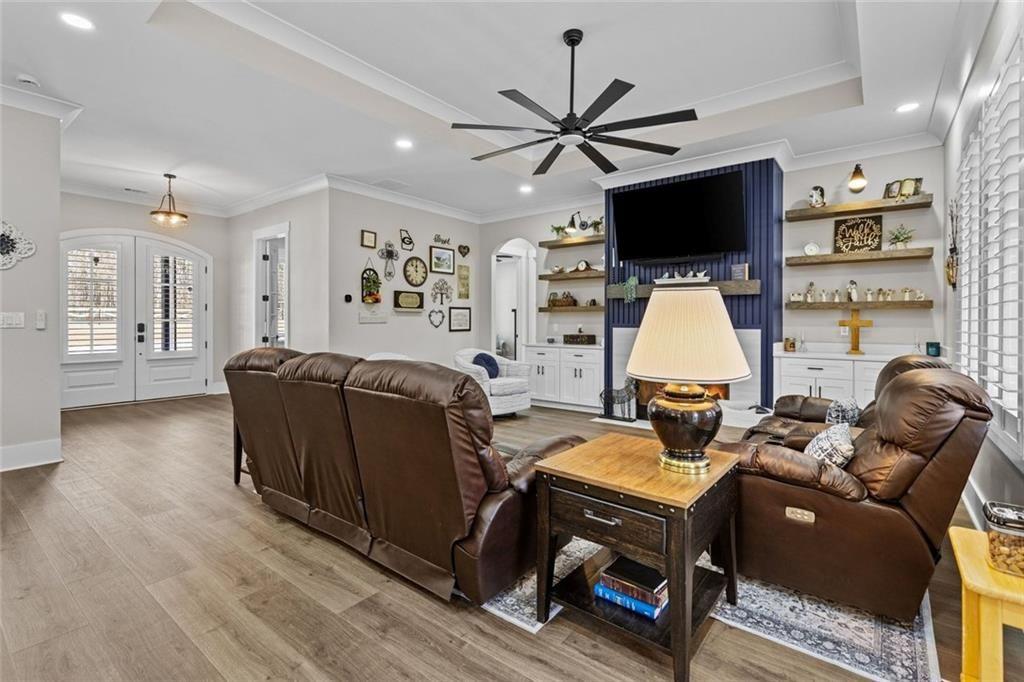 825 Arch Tanner Road Bethlehem, GA 30620 - Photo 11 of 58 a living room with furniture a flat screen tv and a window