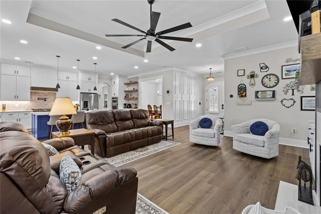 825 Arch Tanner Road Bethlehem, GA 30620 - Photo 12 of 58 a living room with furniture and kitchen view