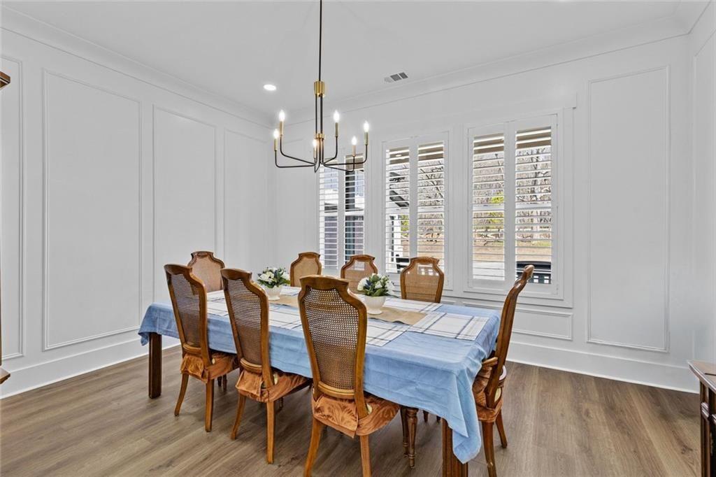 825 Arch Tanner Road Bethlehem, GA 30620 - Photo 20 of 58 a view of a dining room with furniture window and wooden floor
