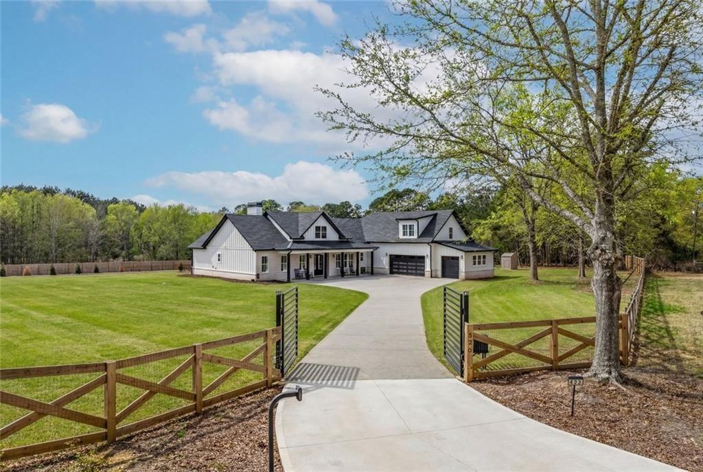 825 Arch Tanner Road Bethlehem, GA 30620 - Photo 2 of 58 a front view of a house with garden