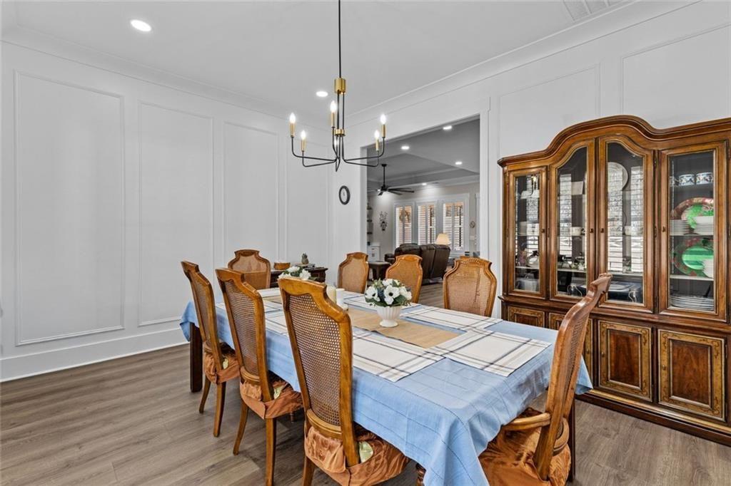 825 Arch Tanner Road Bethlehem, GA 30620 - Photo 22 of 58 a view of a dining room with furniture window and wooden floor