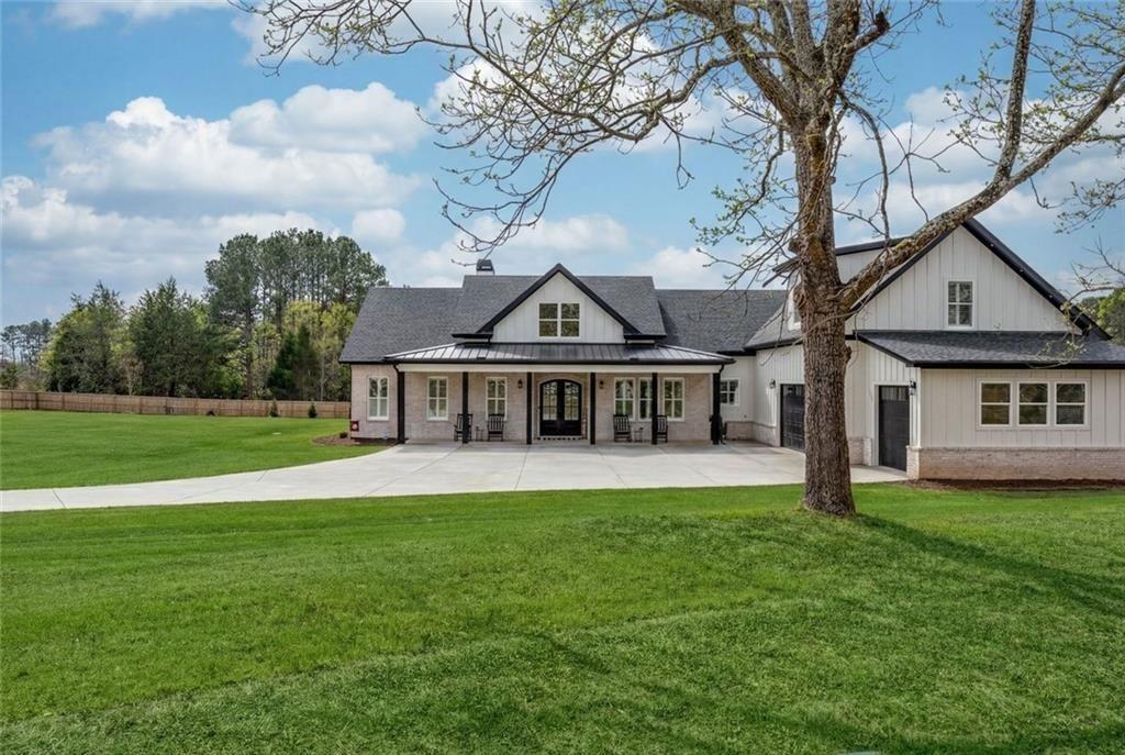 825 Arch Tanner Road Bethlehem, GA 30620 - Photo 3 of 58 a view of a house with a big yard and large trees