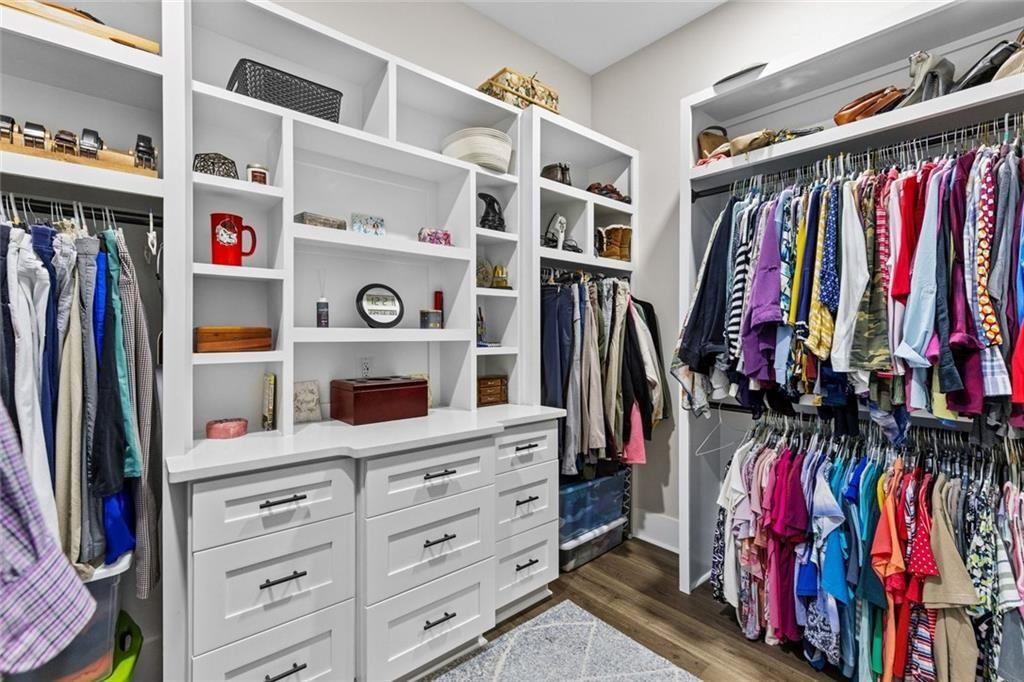 825 Arch Tanner Road Bethlehem, GA 30620 - Photo 31 of 58 a view of walk in closet with clothes and shoes