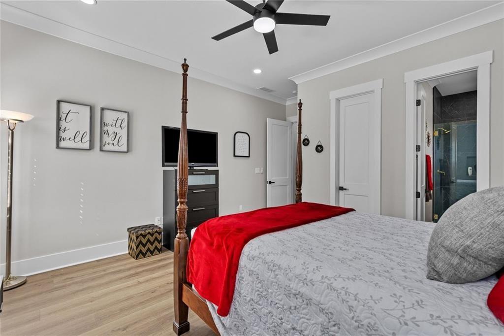 825 Arch Tanner Road Bethlehem, GA 30620 - Photo 35 of 58 a bedroom with a bed and a flat screen tv