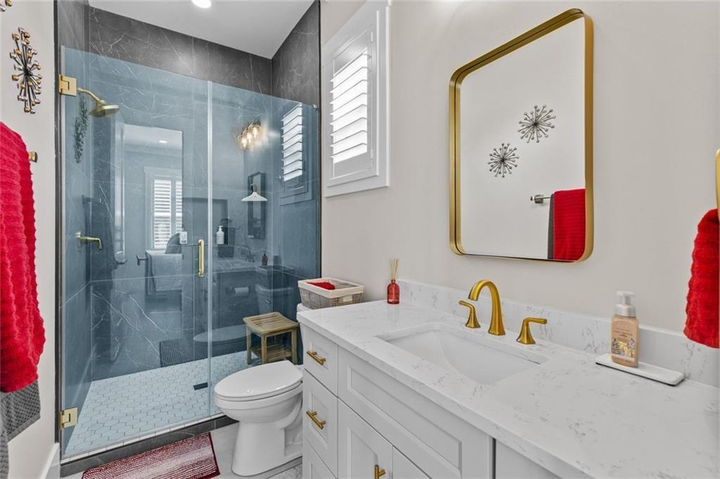 825 Arch Tanner Road Bethlehem, GA 30620 - Photo 36 of 58 a bathroom with a sink toilet and shower