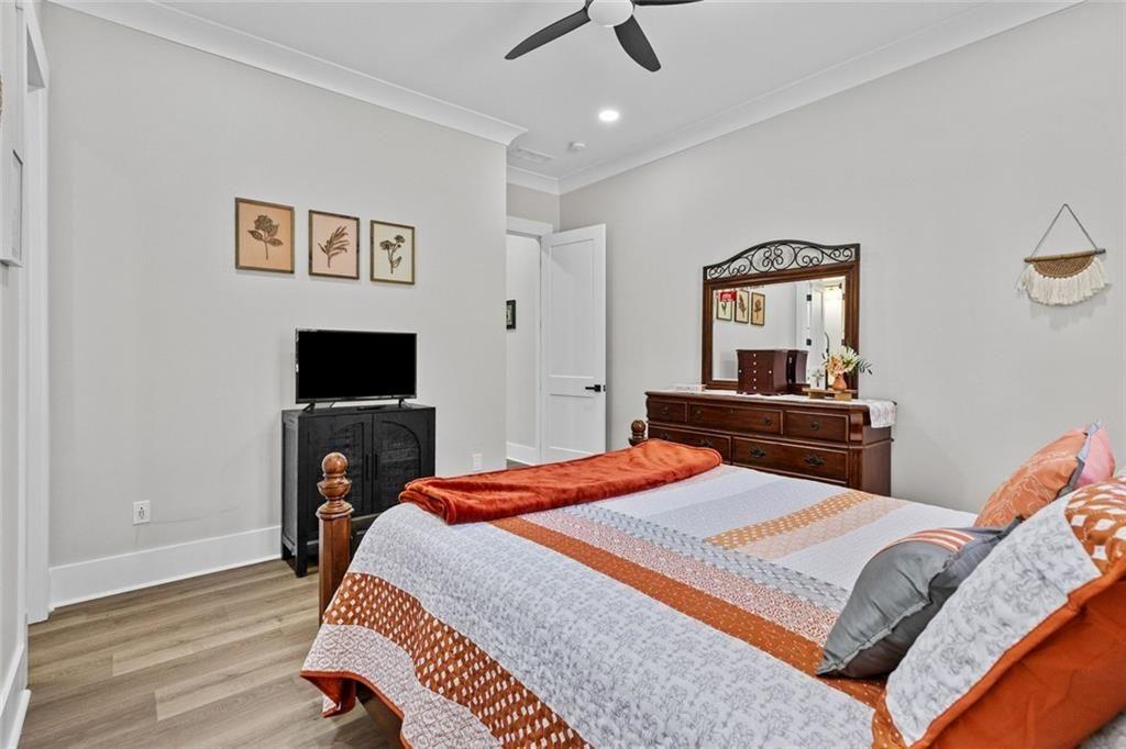 825 Arch Tanner Road Bethlehem, GA 30620 - Photo 39 of 58 a bedroom with a bed and a television