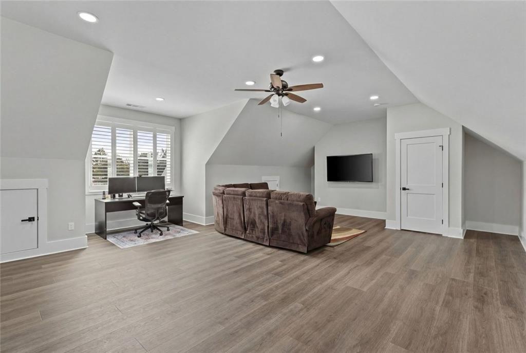 825 Arch Tanner Road Bethlehem, GA 30620 - Photo 42 of 58 a living room with furniture and a flat screen tv