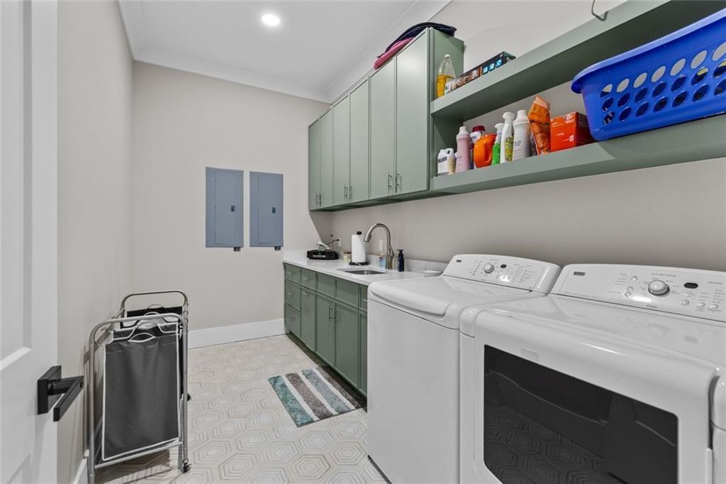 825 Arch Tanner Road Bethlehem, GA 30620 - Photo 43 of 58 a utility room with dryer washer and a view of living room