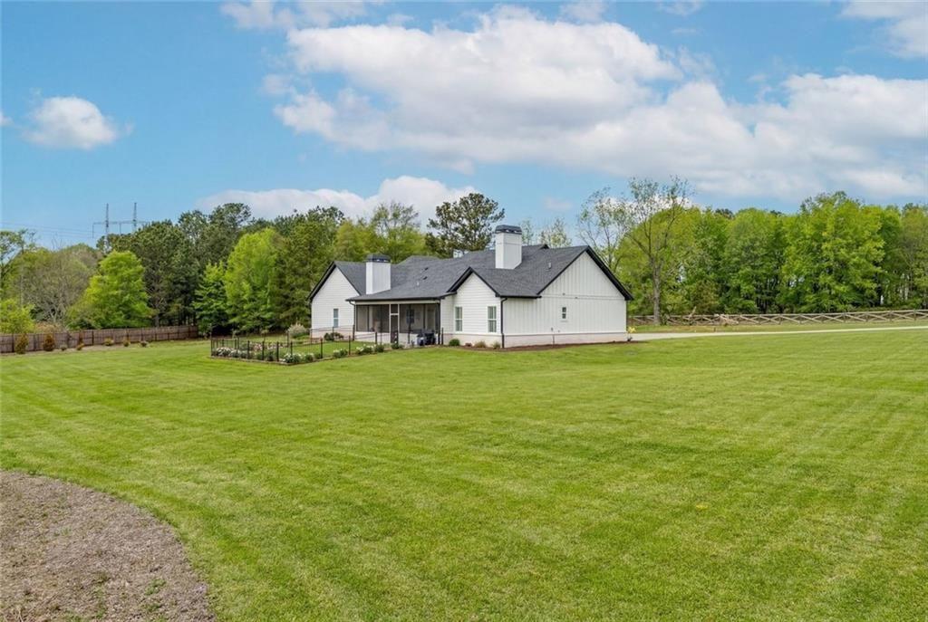 825 Arch Tanner Road Bethlehem, GA 30620 - Photo 48 of 58 a aerial view of a house with big yard and large trees