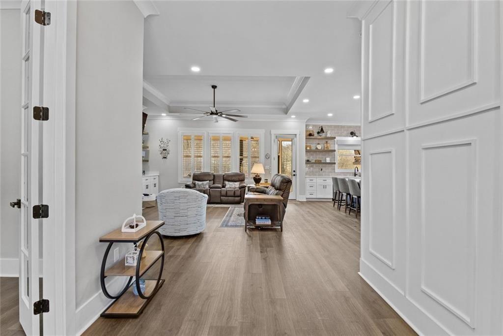 825 Arch Tanner Road Bethlehem, GA 30620 - Photo 5 of 58 a living room with furniture and a wooden floor