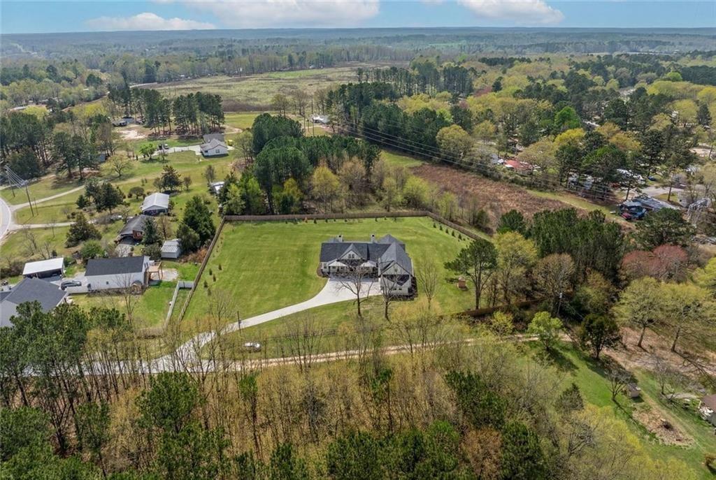 825 Arch Tanner Road Bethlehem, GA 30620 - Photo 55 of 58 an aerial view of residential houses with outdoor space and trees