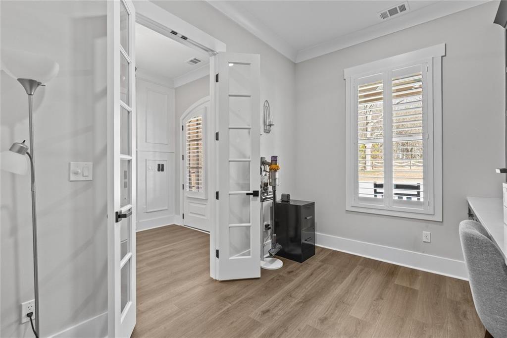 825 Arch Tanner Road Bethlehem, GA 30620 - Photo 8 of 58 an empty room with wooden floor and a window