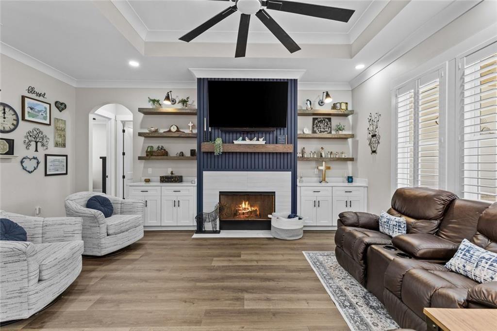 825 Arch Tanner Road Bethlehem, GA 30620 - Photo 10 of 58 a living room with furniture a flat screen tv and a fireplace