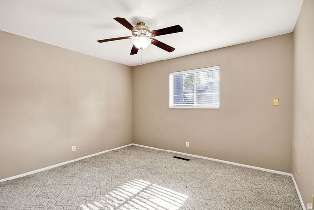 240 East 400 North, Unit 26 Logan, UT 84321 - Photo 5 of 12 Neutral-toned walls complement the patterned carpet flooring