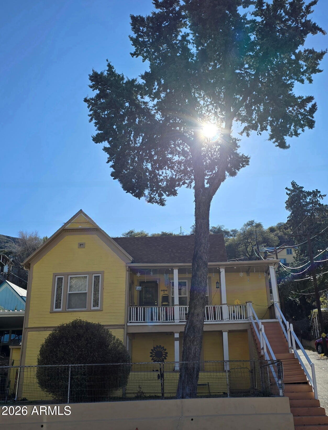 a front view of a house with yard and parking space