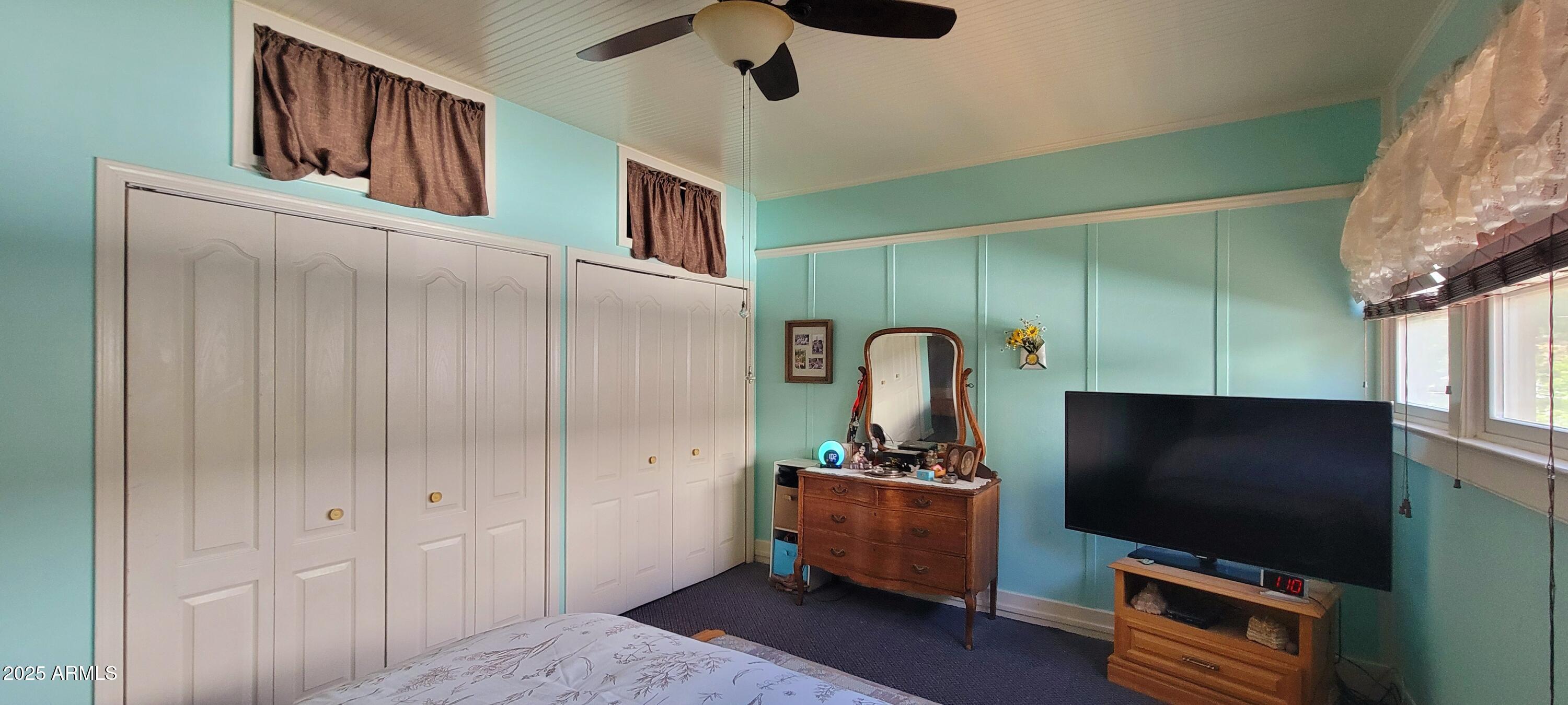 416 Tombstone Canyon Bisbee, AZ 85603 - Photo 12 of 42 a living room with furniture and a flat screen tv
