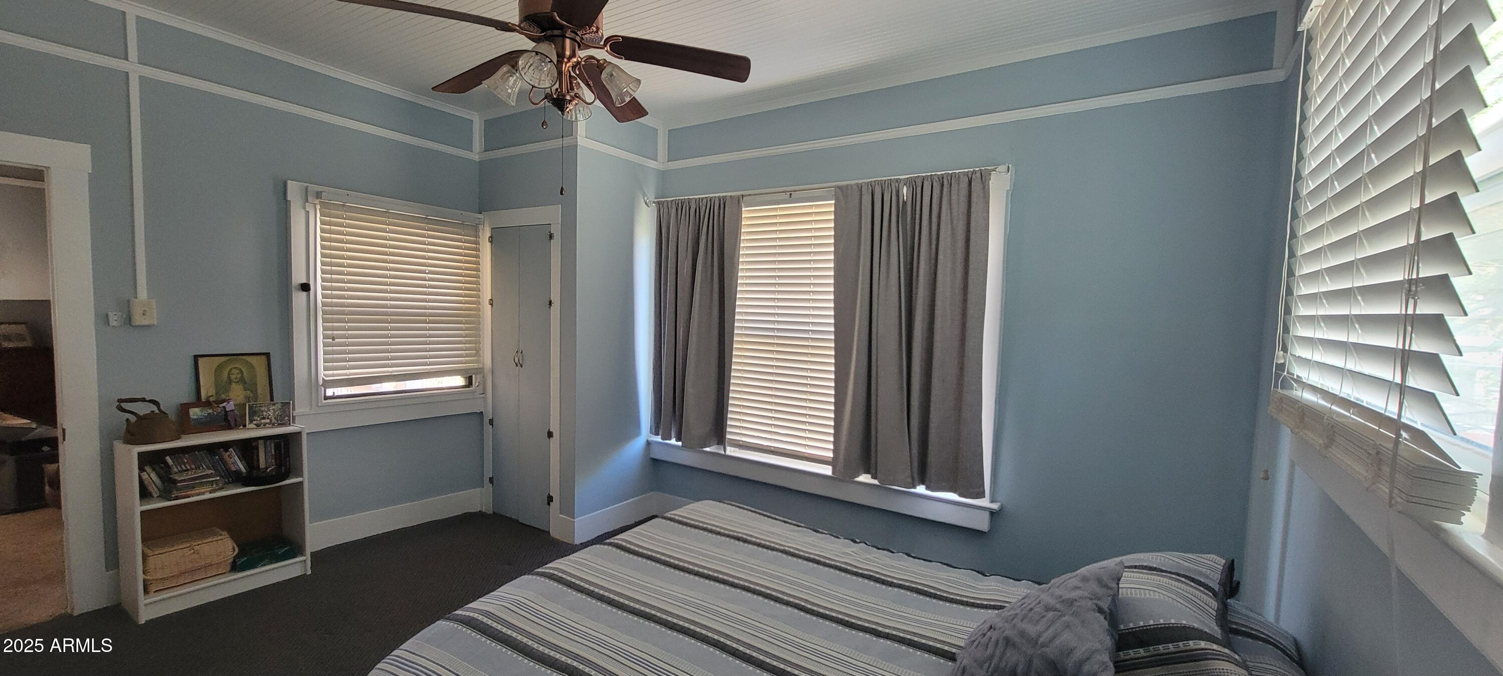 416 Tombstone Canyon Bisbee, AZ 85603 - Photo 13 of 42 a view of empty room with windows and ceiling fan