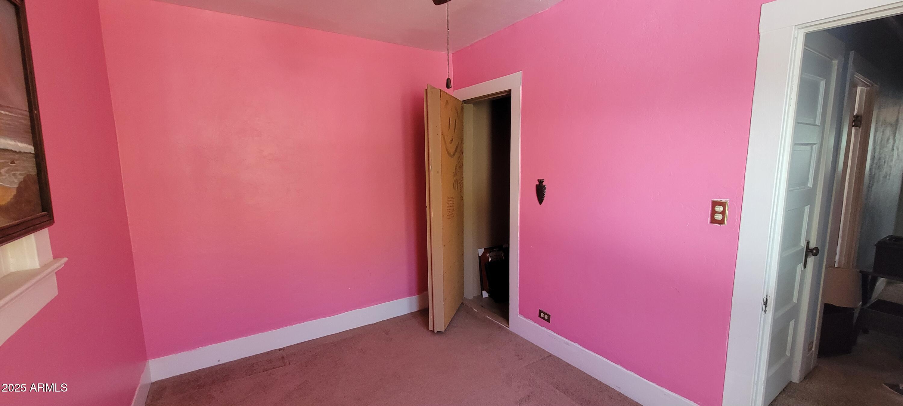 416 Tombstone Canyon Bisbee, AZ 85603 - Photo 18 of 42 an empty room with painted walls