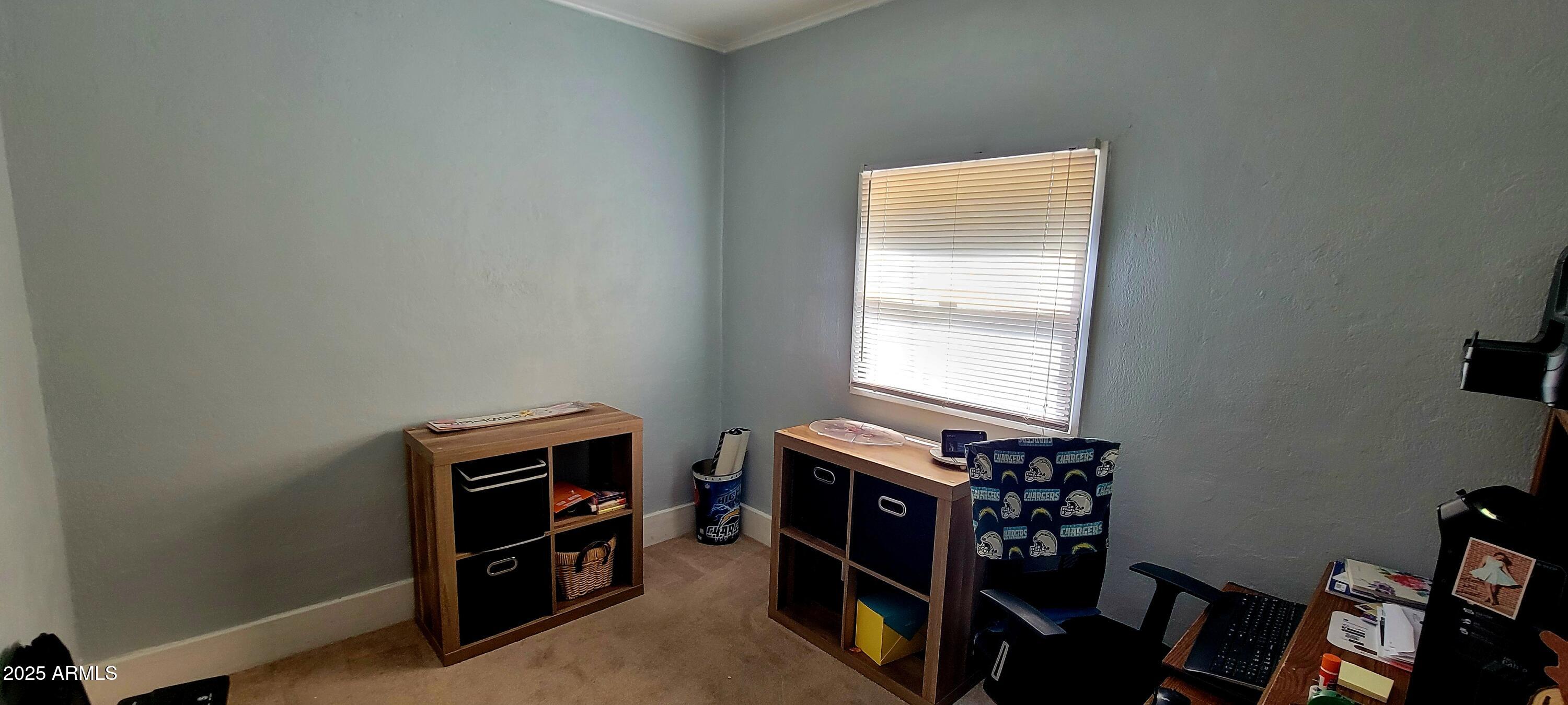 416 Tombstone Canyon Bisbee, AZ 85603 - Photo 20 of 42 a room with furniture a air conditioner and a window