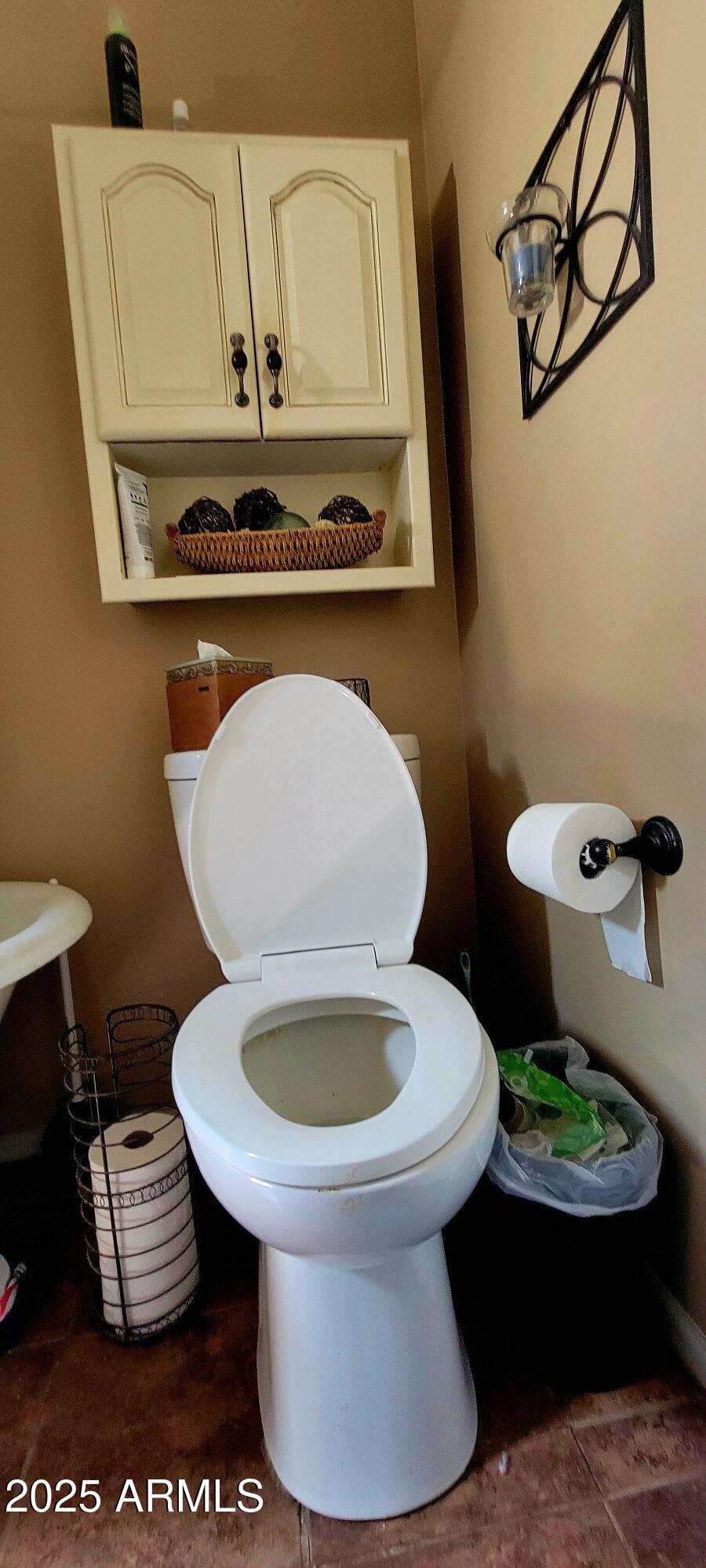 416 Tombstone Canyon Bisbee, AZ 85603 - Photo 23 of 42 a bathroom with a toilet and a sink