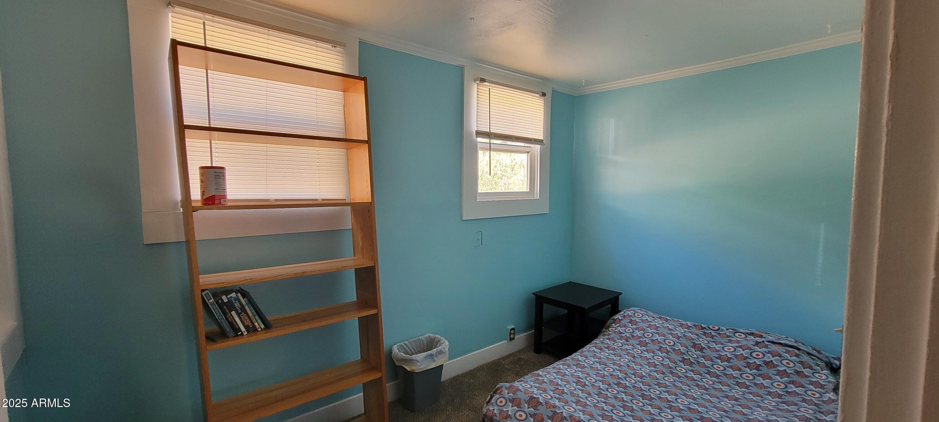416 Tombstone Canyon Bisbee, AZ 85603 - Photo 36 of 42 a bedroom with a bed and a window