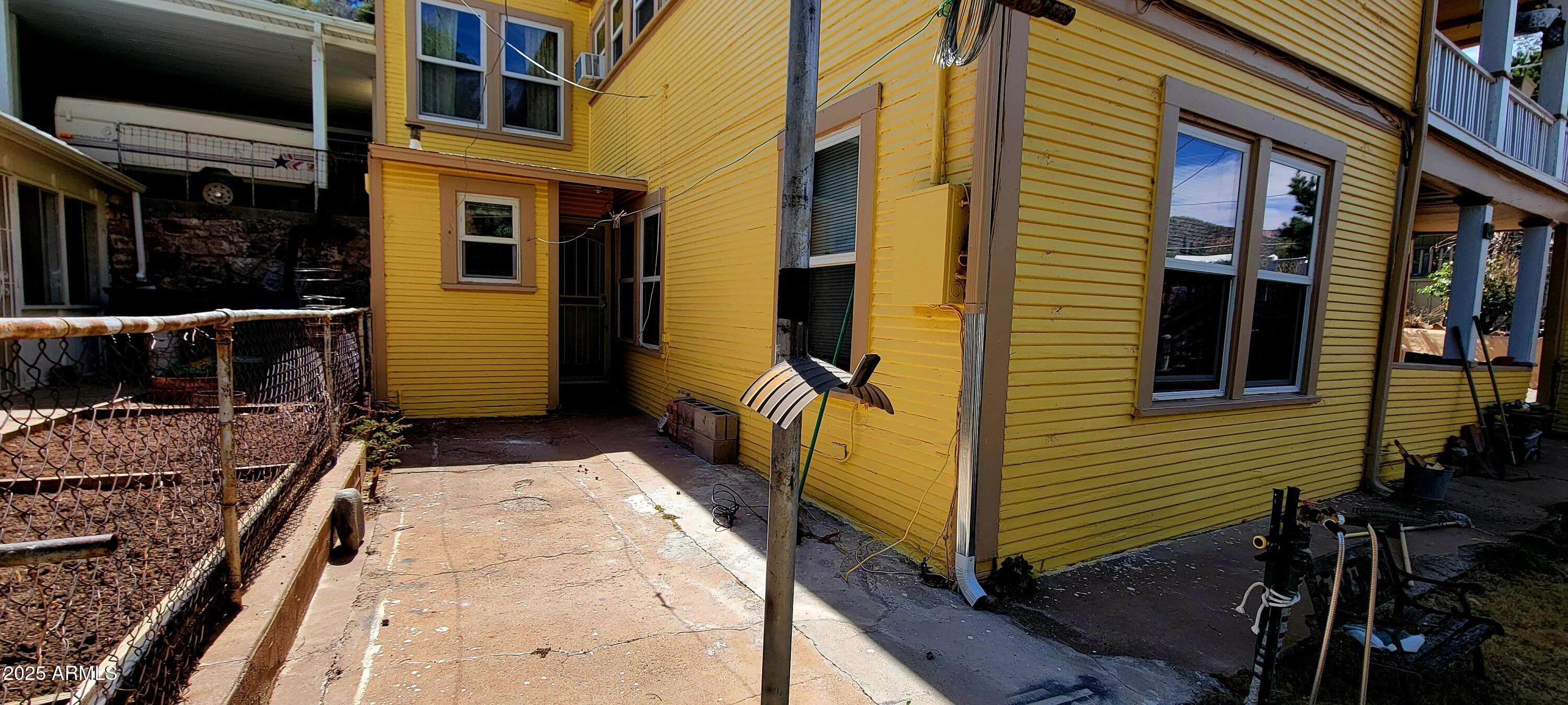 416 Tombstone Canyon Bisbee, AZ 85603 - Photo 40 of 42 a view of a brick house with many windows