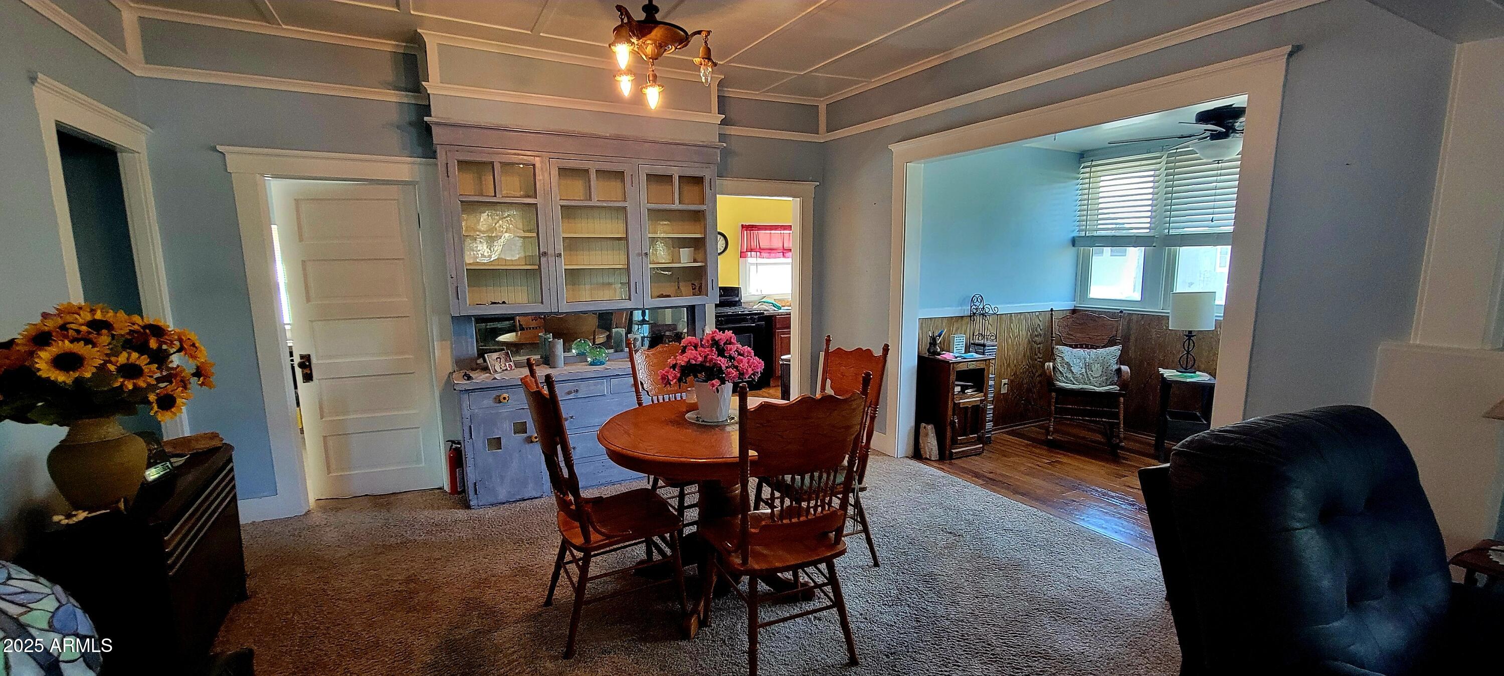 416 Tombstone Canyon Bisbee, AZ 85603 - Photo 6 of 42 a view of a dining room with furniture and chandelier