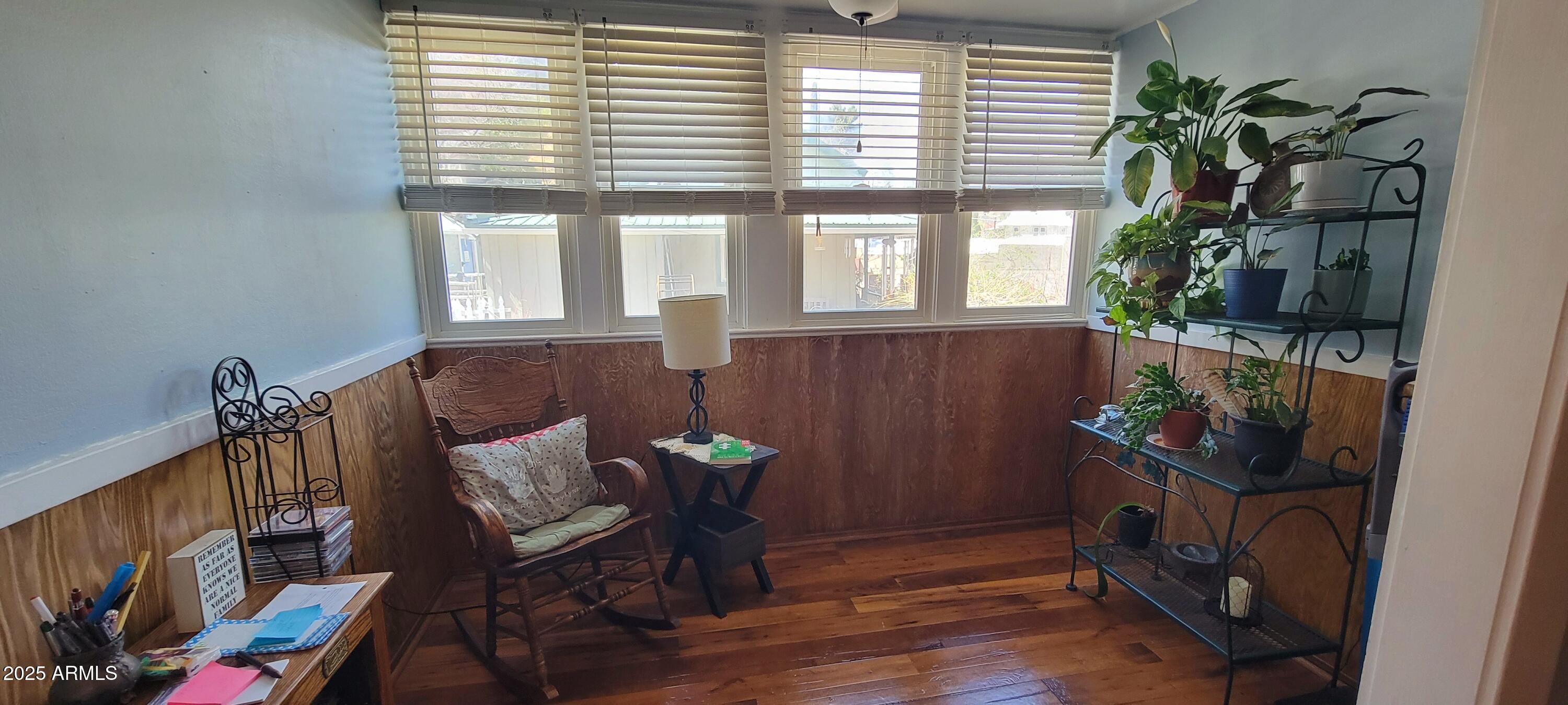416 Tombstone Canyon Bisbee, AZ 85603 - Photo 7 of 42 a living room with furniture and a potted plant