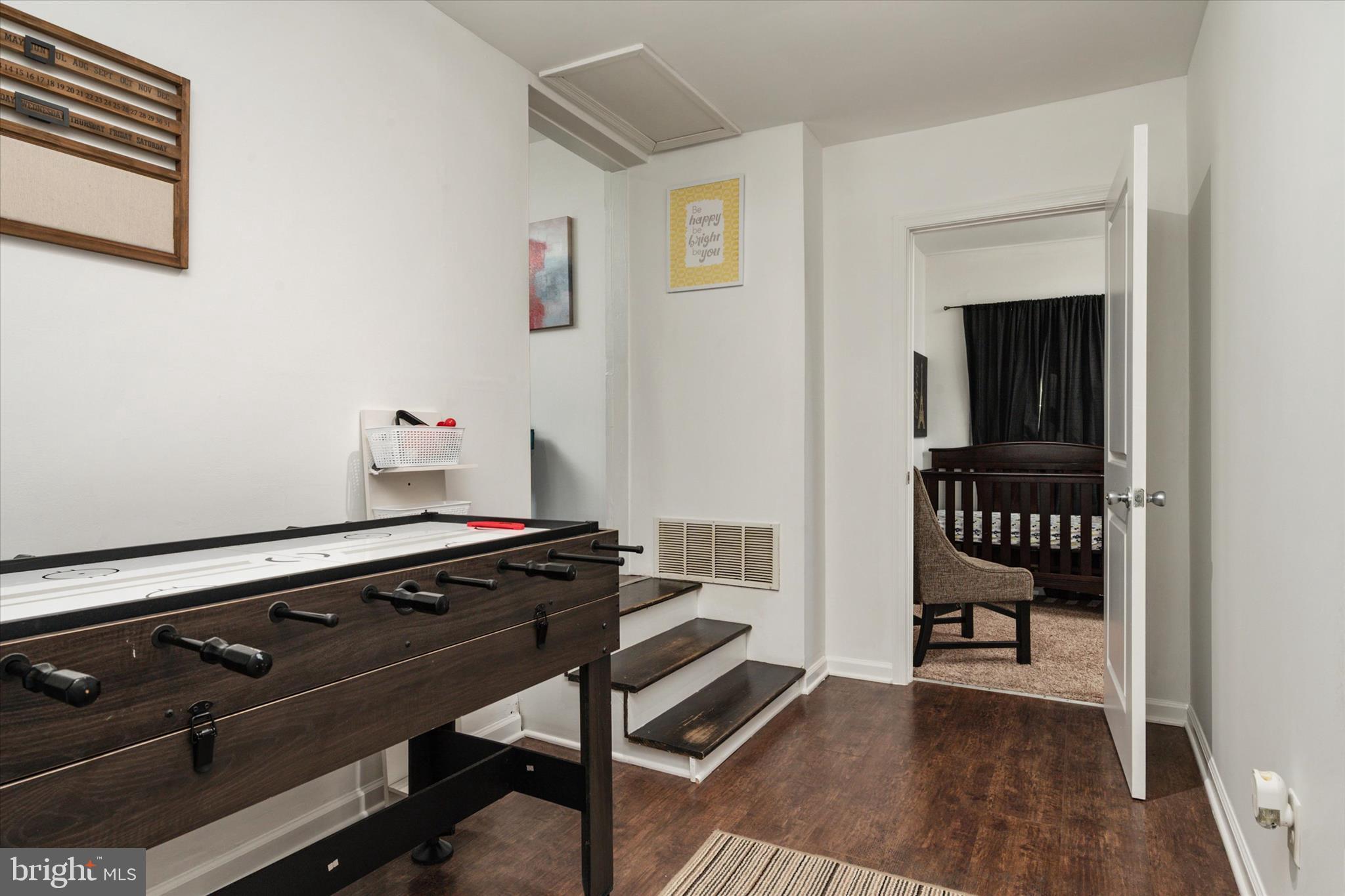 108 Wilson Road Grasonville, MD 21658 - Photo 23 of 38 a view of a hallway with chairs and wooden floor