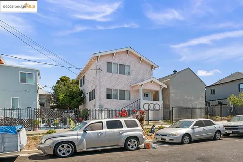 a front view of a house with parking space