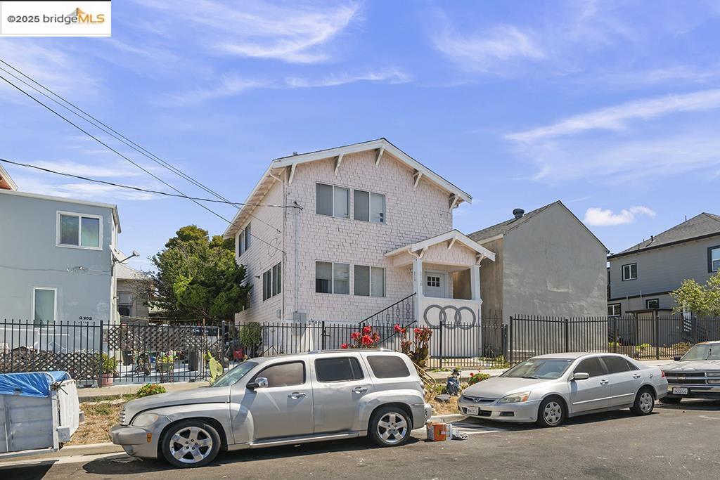 2004 27th Avenue Oakland, CA 94601 - Photo 12 of 14 a front view of a house with parking space