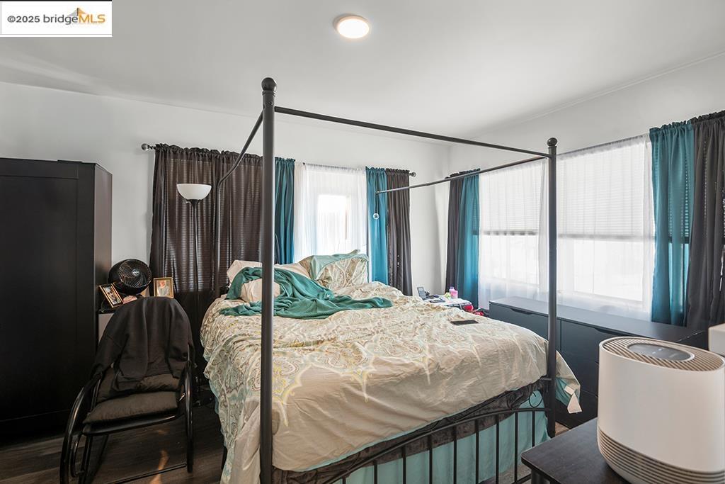 2004 27th Avenue Oakland, CA 94601 - Photo 7 of 14 a bedroom with a bed window and a flat tv screen