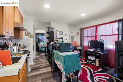 a view of a workspace with furniture and a kitchen