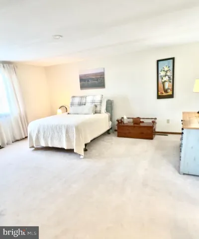 a view of a lake with houses in the back