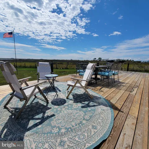 a view of a dinning tables and chairs in patio