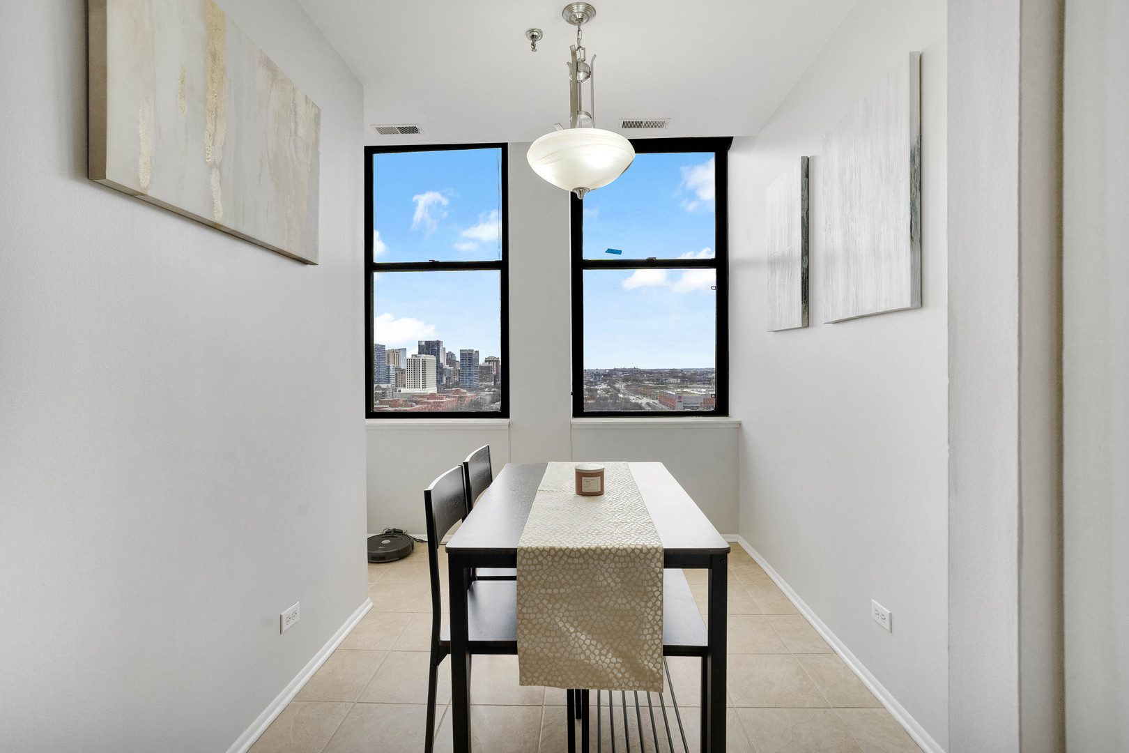 780 South Federal Street, Unit 1210 Chicago, IL 60605 - Photo 8 of 20 a view of a dining room with furniture and wooden floor