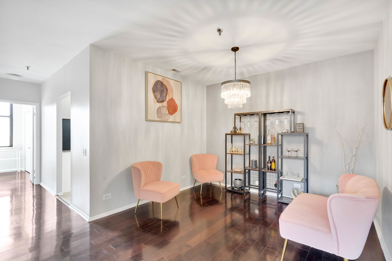 780 South Federal Street, Unit 1210 Chicago, IL 60605 - Photo 9 of 20 a dining room with furniture a chandelier and wooden floor