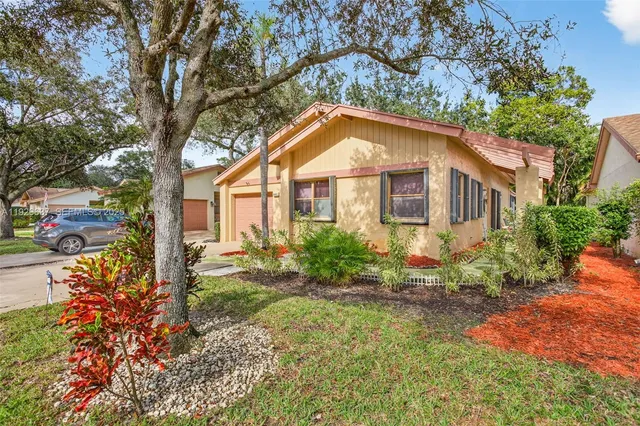 a house view with a garden space