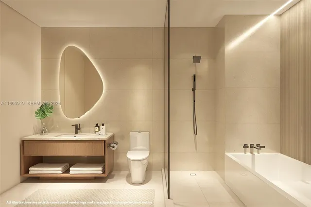a bathroom with a toilet a sink a tub and a mirror