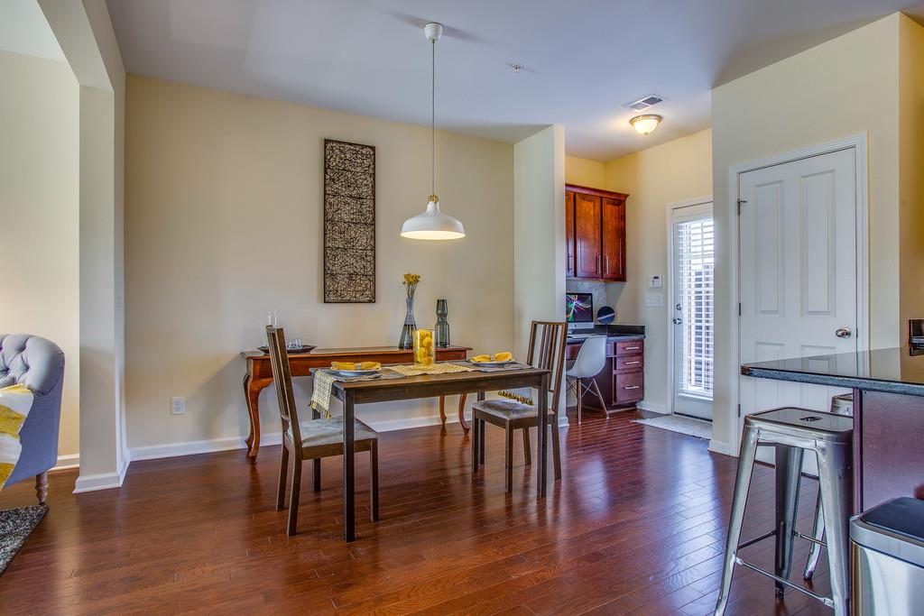 2046 Hemlock Drive Spring Hill, TN 37174 - Photo 12 of 28 a view of a a dining room with furniture window and wooden floor