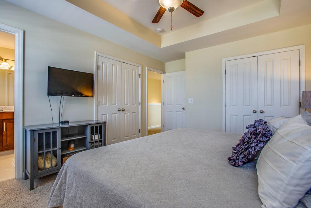 2046 Hemlock Drive Spring Hill, TN 37174 - Photo 16 of 28 a bedroom with a bed and a flat screen tv
