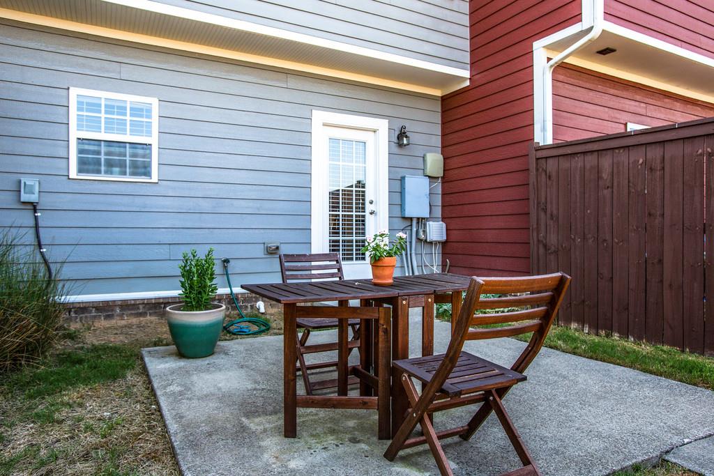 2046 Hemlock Drive Spring Hill, TN 37174 - Photo 27 of 28 a view of a backyard with a table and chairs