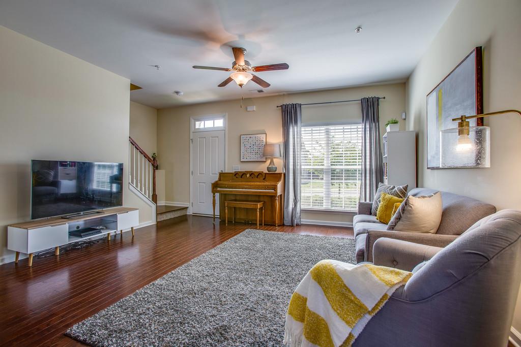 2046 Hemlock Drive Spring Hill, TN 37174 - Photo 4 of 28 a living room with furniture flat screen tv and wooden floor