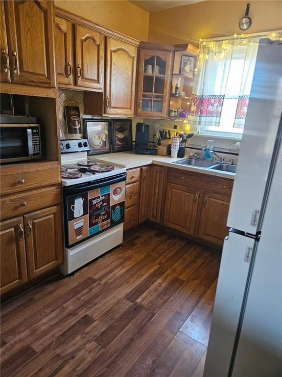 143 Whitestown Road Lyndora, PA 16045 - Photo 7 of 18 a kitchen with stainless steel appliances granite countertop a stove a sink dishwasher and a microwave oven with wooden floor