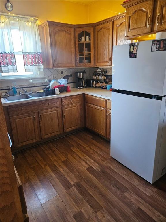 143 Whitestown Road Lyndora, PA 16045 - Photo 8 of 18 a kitchen with a sink a refrigerator and cabinets