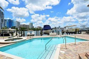 650 Golden Gate Point, Unit 301 Sarasota, FL 34236 - Photo 8 of 31 a view of a swimming pool with sitting area