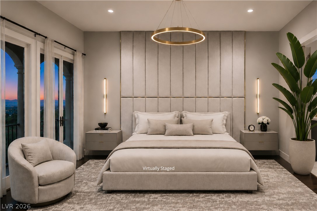6 Rue Du Ville Henderson, NV 89011 - Photo 11 of 99 “Virtually Staged” This primary bedroom offers an expansive view from its private balcony, perfect for serene evenings.