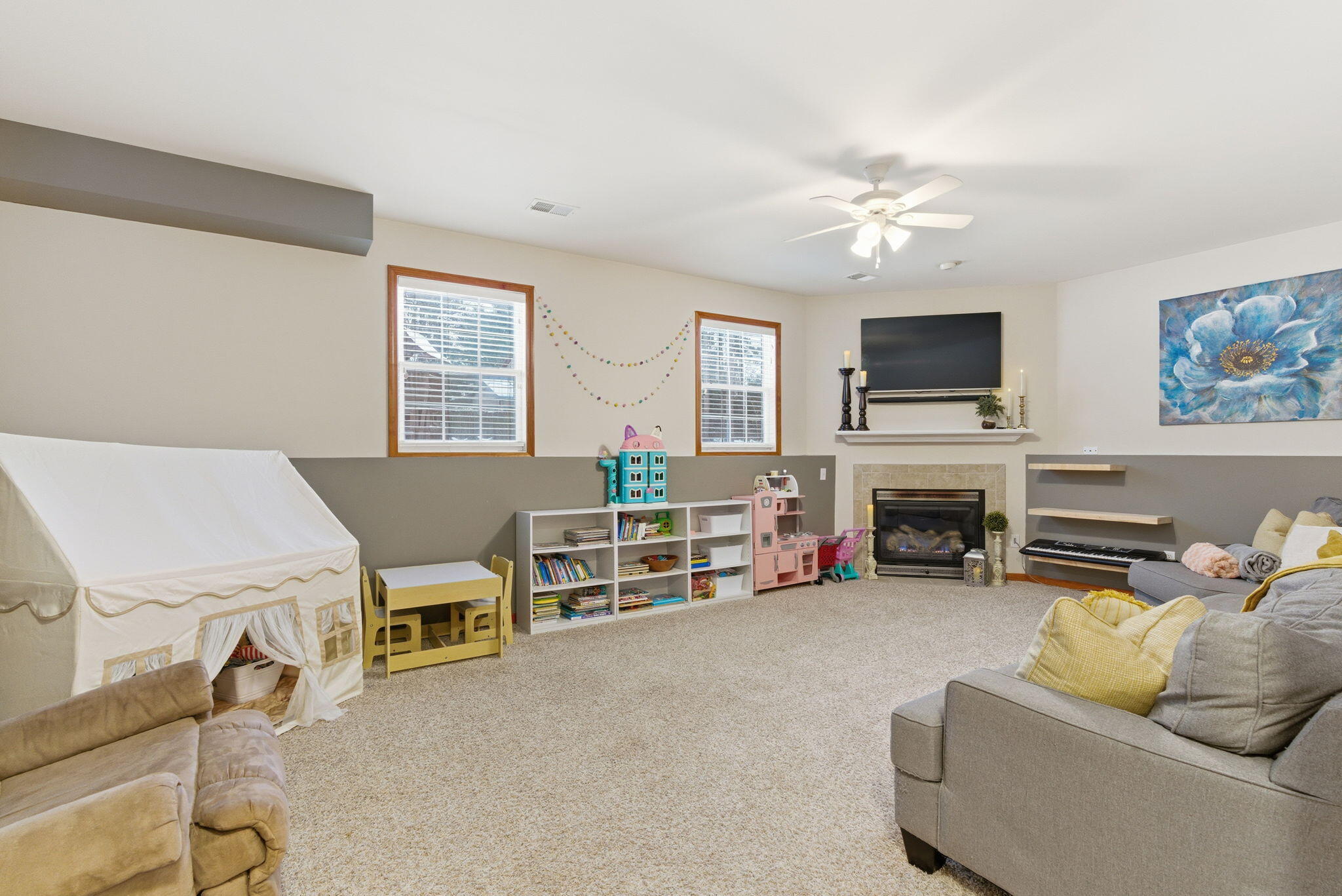 2726 North Goldring Road La Porte, IN 46350 - Photo 21 of 34 a living room with furniture a fireplace and a flat screen tv