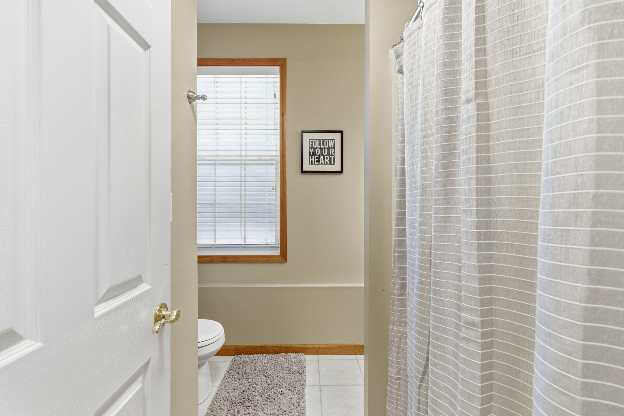 2726 North Goldring Road La Porte, IN 46350 - Photo 25 of 34 a bathroom with a granite countertop toilet and a shower