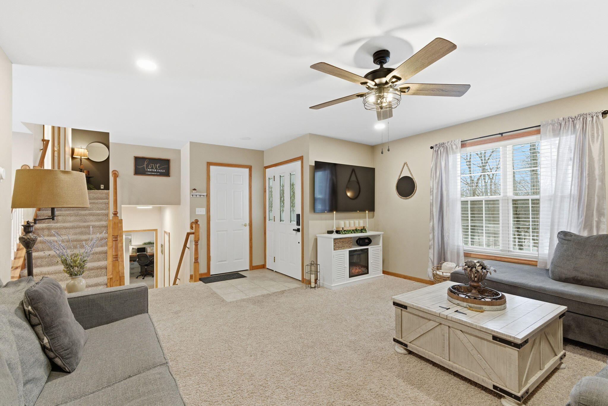 2726 North Goldring Road La Porte, IN 46350 - Photo 5 of 34 a living room with furniture a fireplace and a flat screen tv